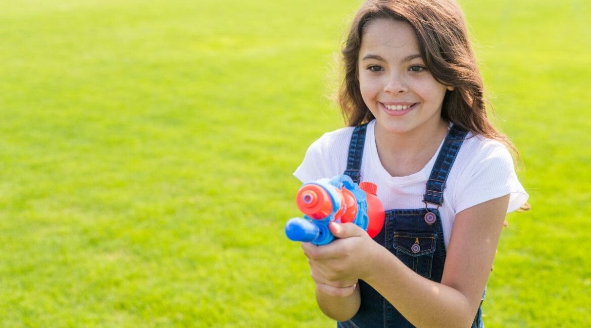Kid is holding water gun