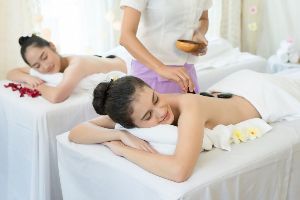 Woman is getting hot stone spa treatment