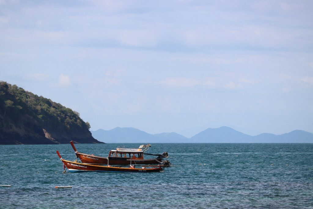 a boat in the sea near Coral Island