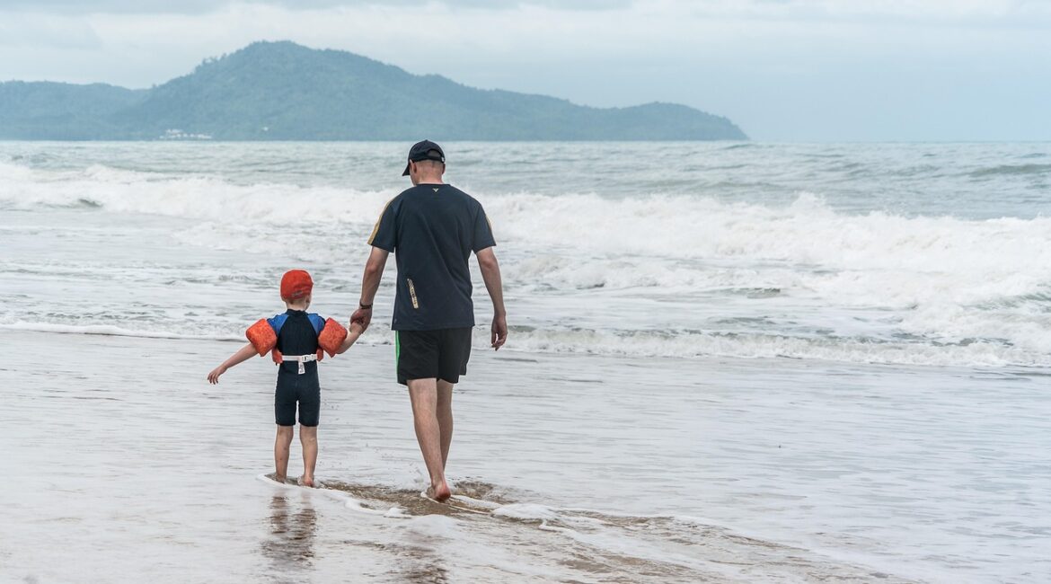 Father and son on a beach